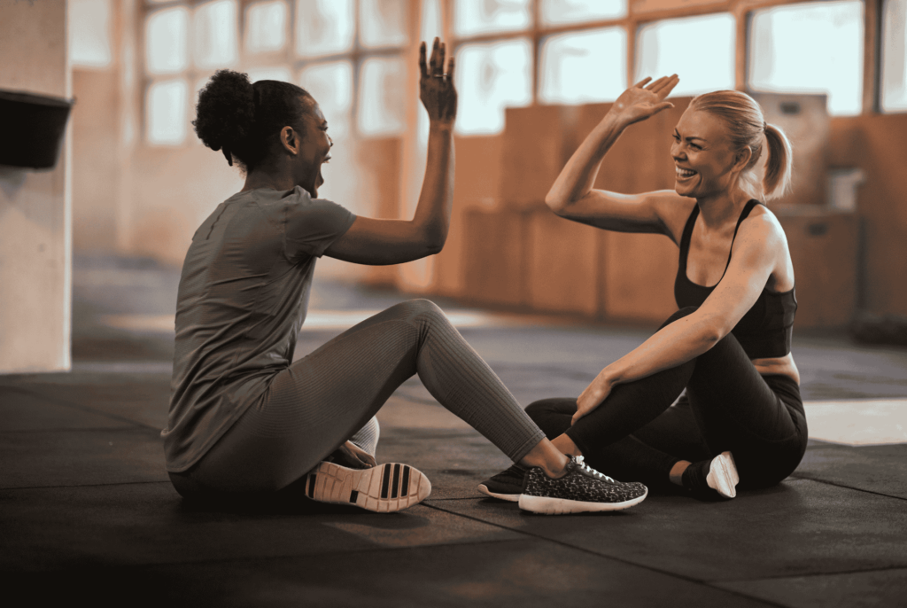 two women in perimenopause working out together and having fun