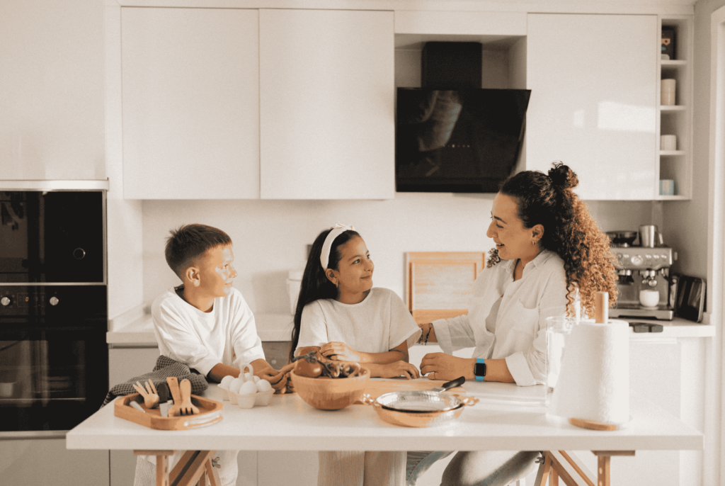 side view of mom with kids in a kitchen meal planning with adhd