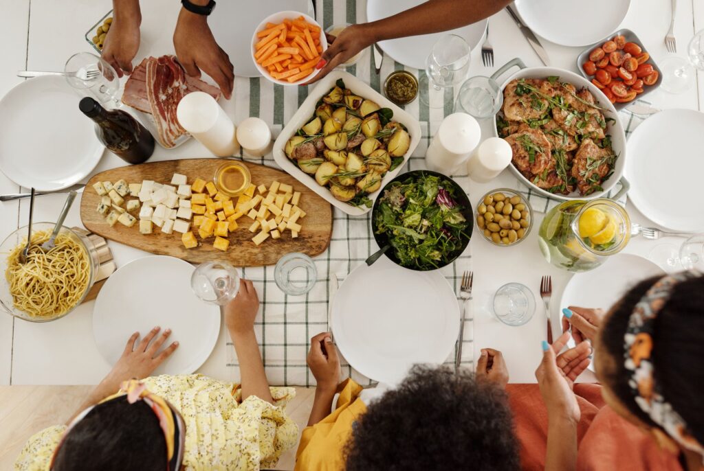 top down view of a family eating a spread of food after consulting with an Edmonton dietitian