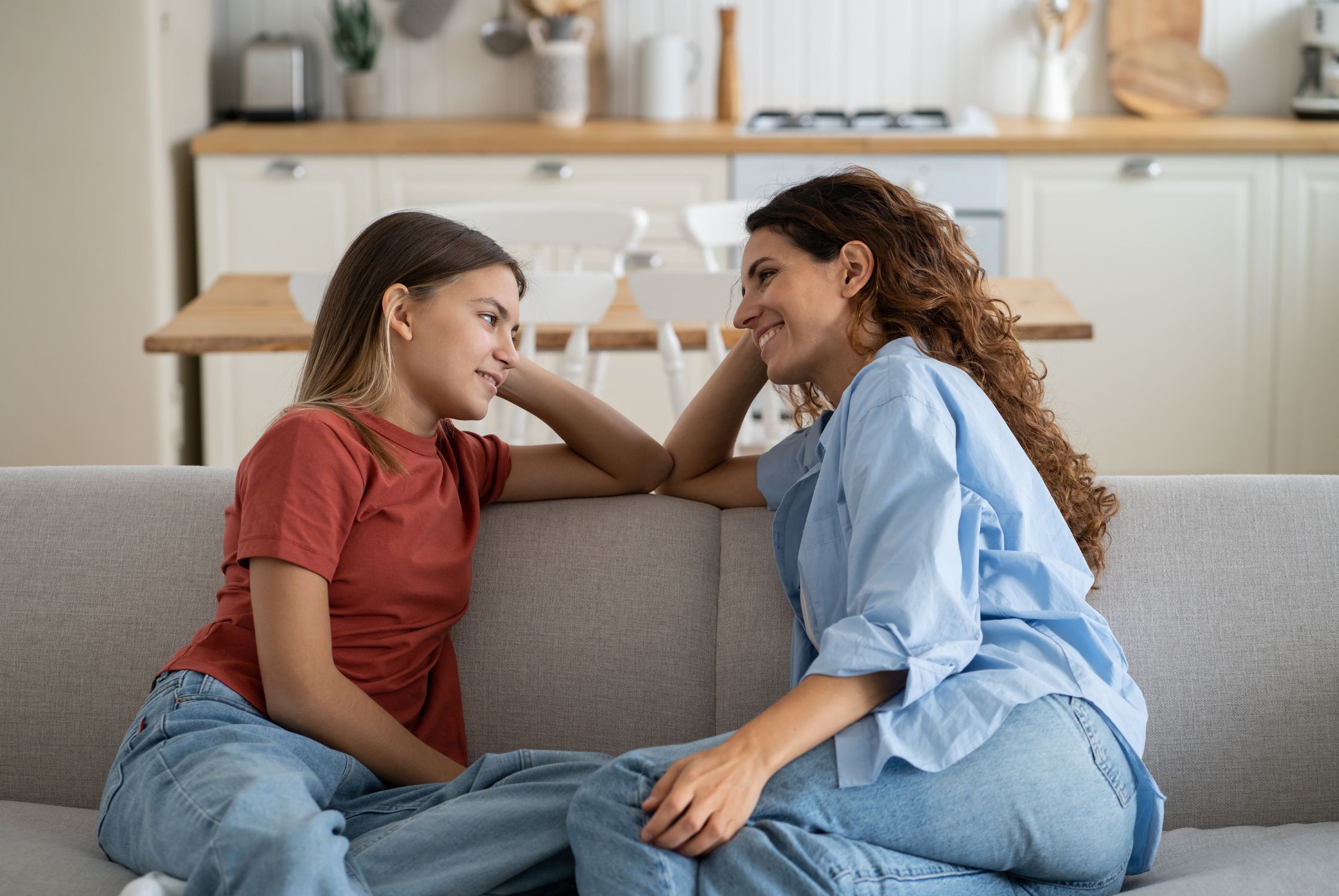 mom and daughter looking happily at one another after seeing an alberta dietitian