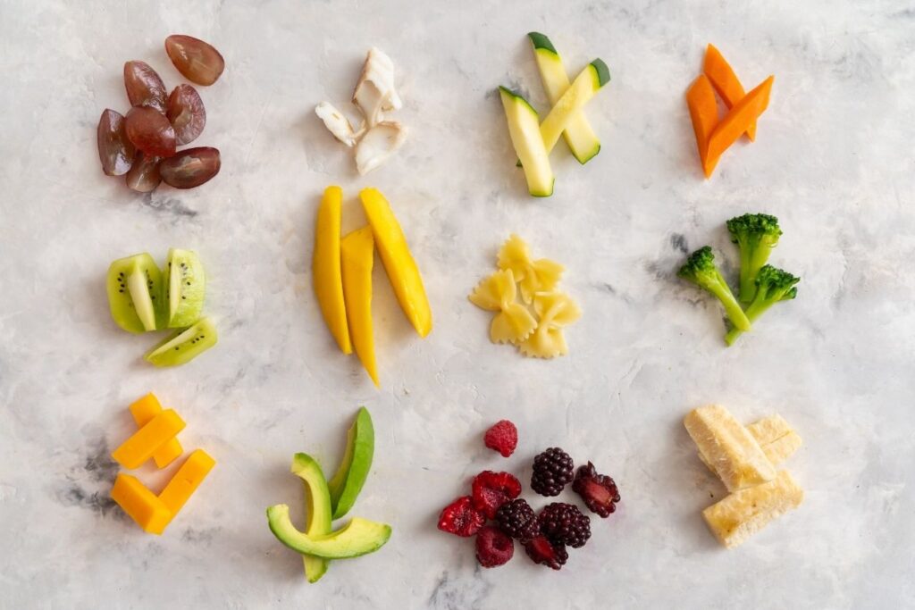 a variety of foods cut for safety for starting solids for babies