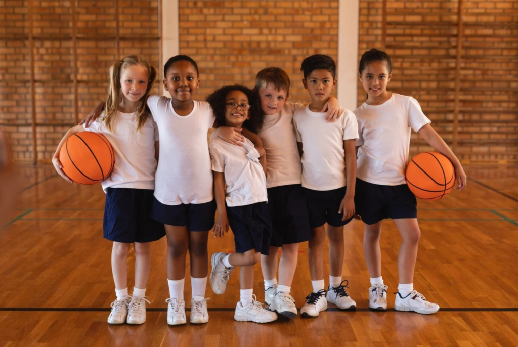 a bunch of kids ready to play after school basketball together